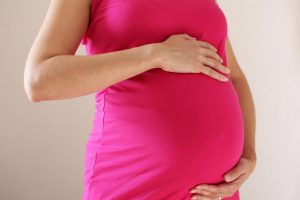 A woman eight months into her pregnancy